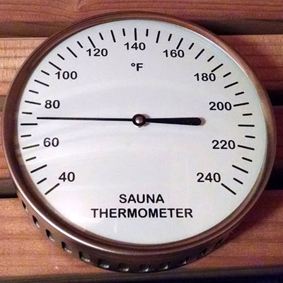 Glass encased thermometer with silver rim (5" diam., °F)