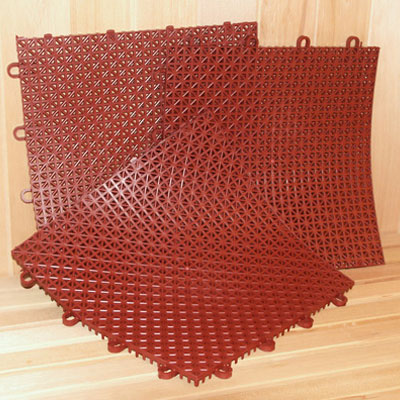 Superdek interlocking molded plastic floor tiles (12" x 12" flexible squares) terra cotta color